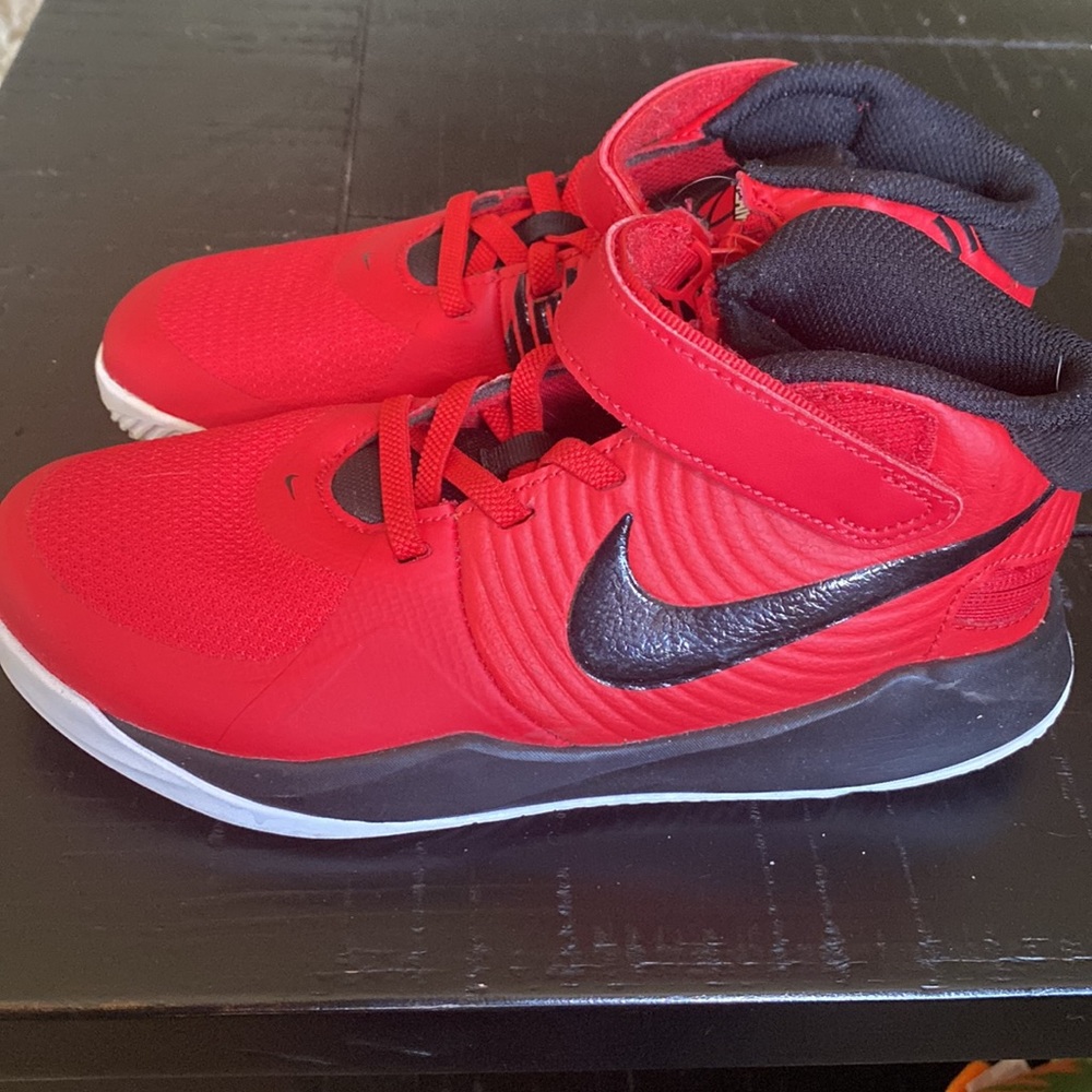 Boys Nike Team Hustle basketball shoes.